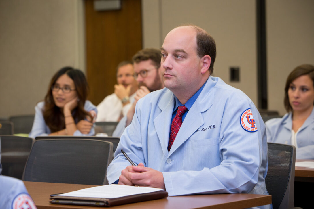 A CME student listens during a lecture