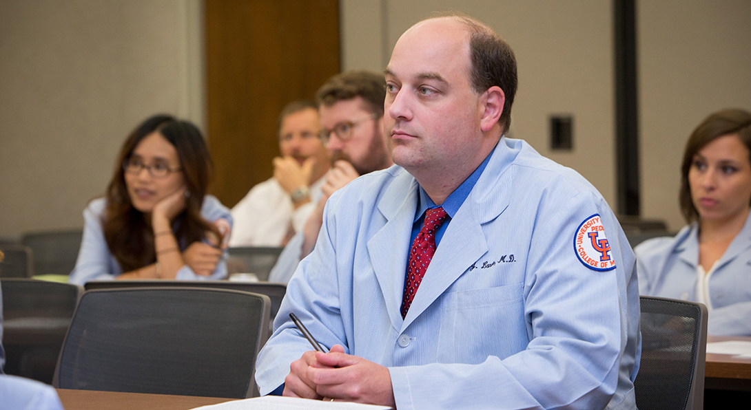 Physicians listen during a continuing medical education course