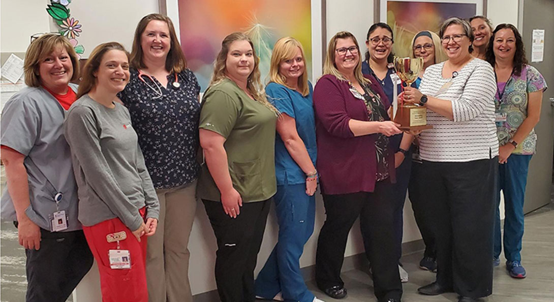 University Pediatrics employees accept the Outstanding Team Award