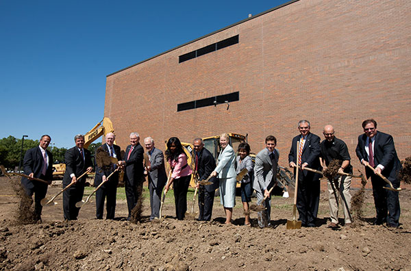 UICOMP Faculty and Staff Holding Shovels at Groundbreaking Ceremony for the Cancer Research Center