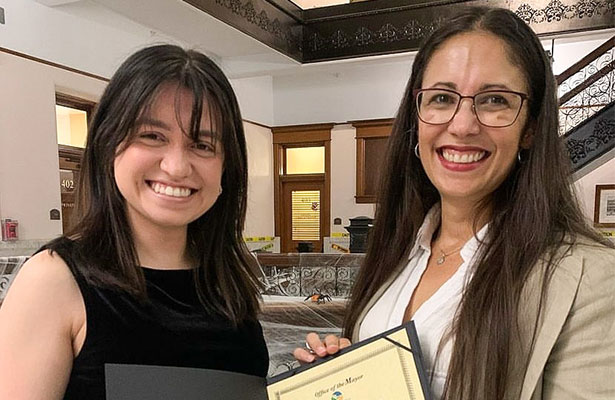 Karina Favela and Elsa Vazquez Melendez, MD holding proclamation issued by Peoria