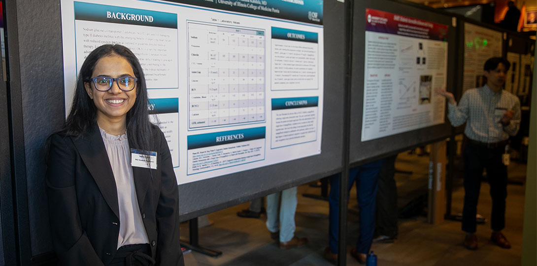 Medical Student in Front of Their Presentation at Research Day