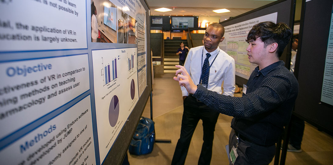 2 Medical Students Talk About a Presentation During Research Day