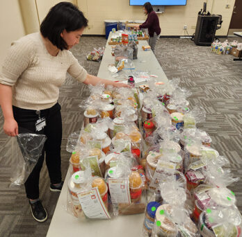 UICOMP student and faculty member put together food pantry meal kits 