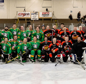 Mighty Docs & Peoria Fire Department Hockey Teams Take a Group Photo
                  
