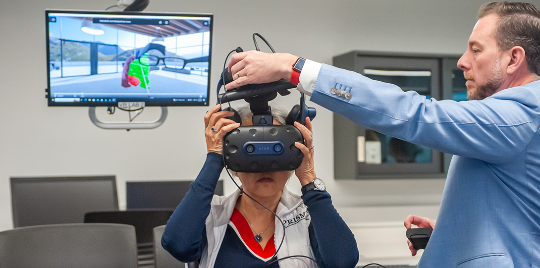 Dr. Bramlet demonstrates VR with UIC Chancellor