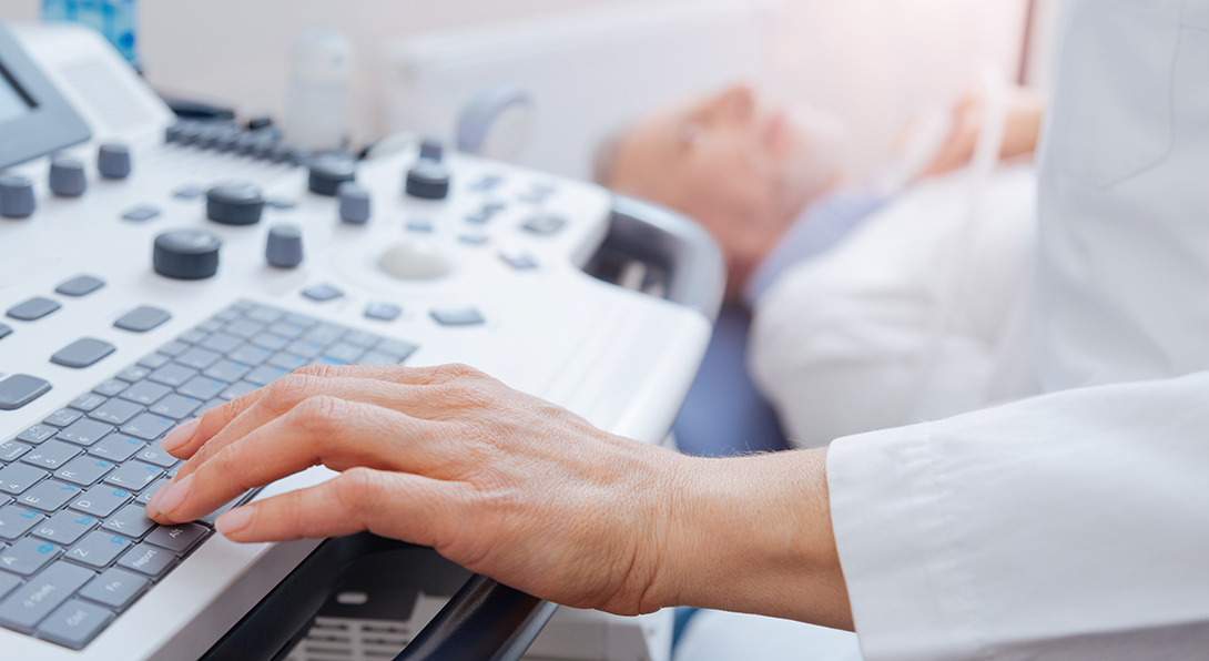 Doctor uses ultrasound equipment