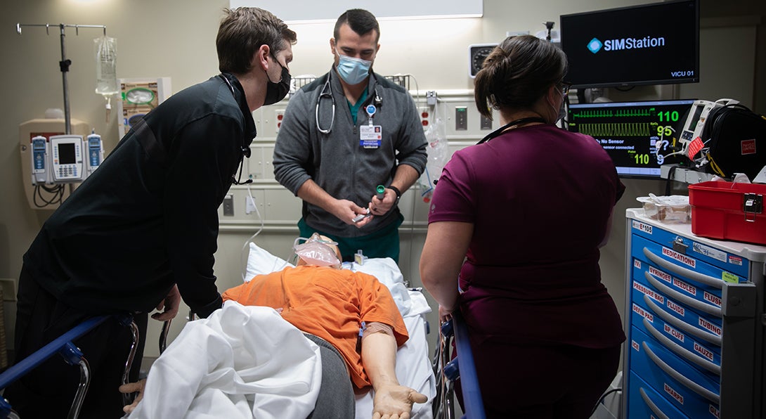 Residents do a simulation exercise at Jump Simulation center